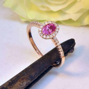 Rose Gold Oval Pink Sapphire Engagement Ring with Diamond Halo