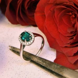 White Gold Emerald and Diamond Halo Ring