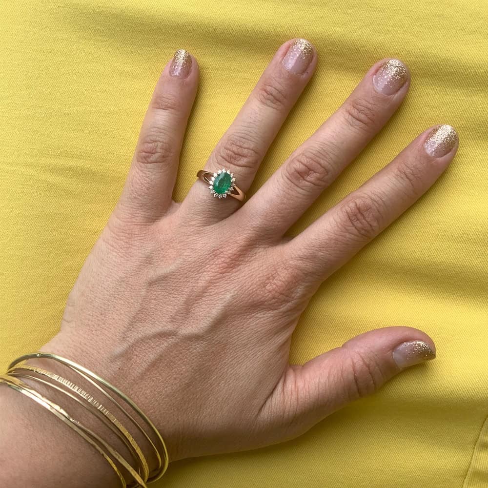 yellow gold oval-cut emerald and diamond halo ring