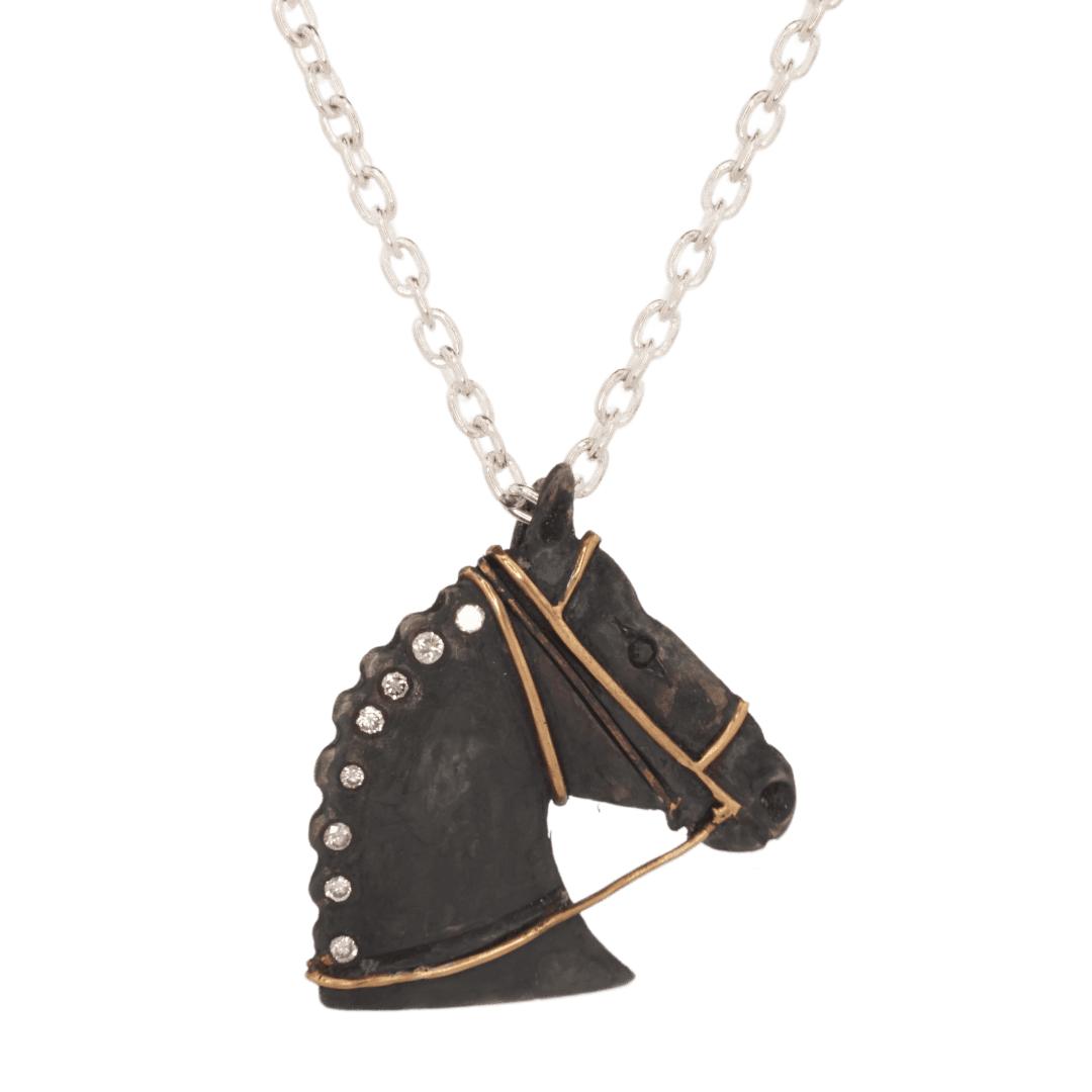 Silver and gold horse head pendant with diamonds and sapphire