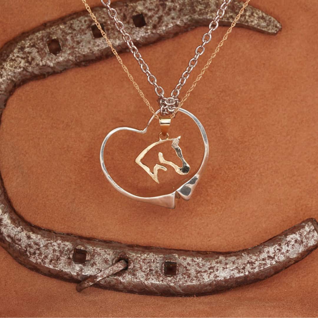 Silver horse nail heart pendant and yellow gold horse head pendant