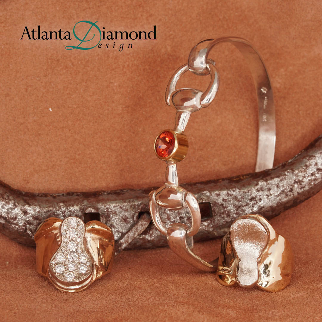 Gold and diamond saddle rings and silver garnet horse bit bracelet