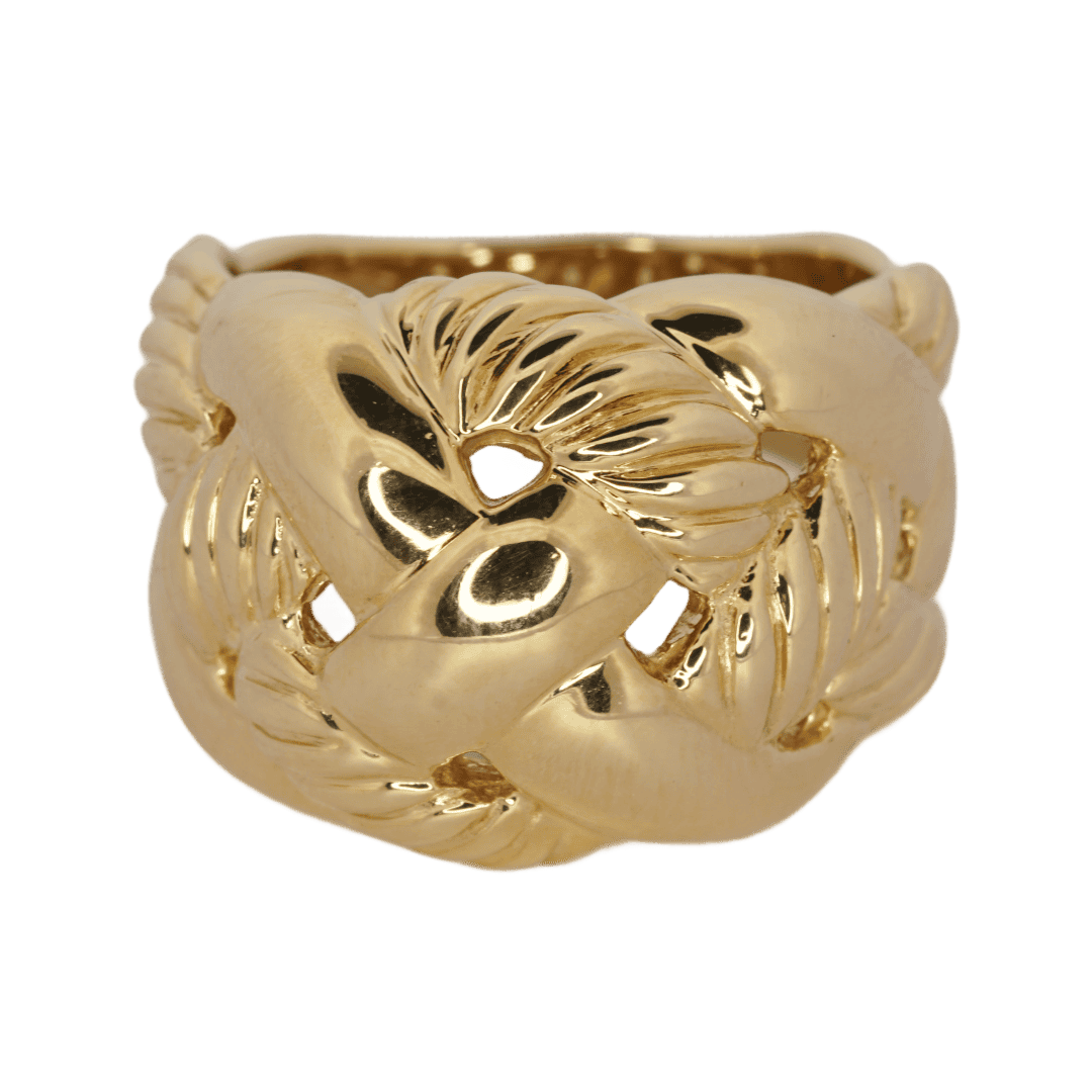 A gold ring with a knot design.